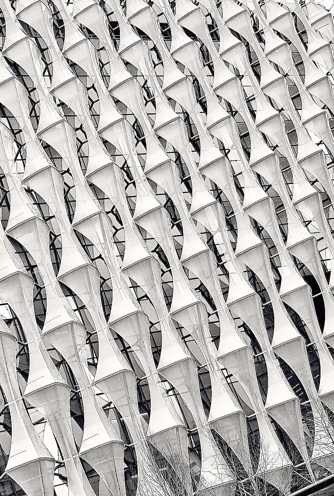 Facade texture of repeating triangular relief.